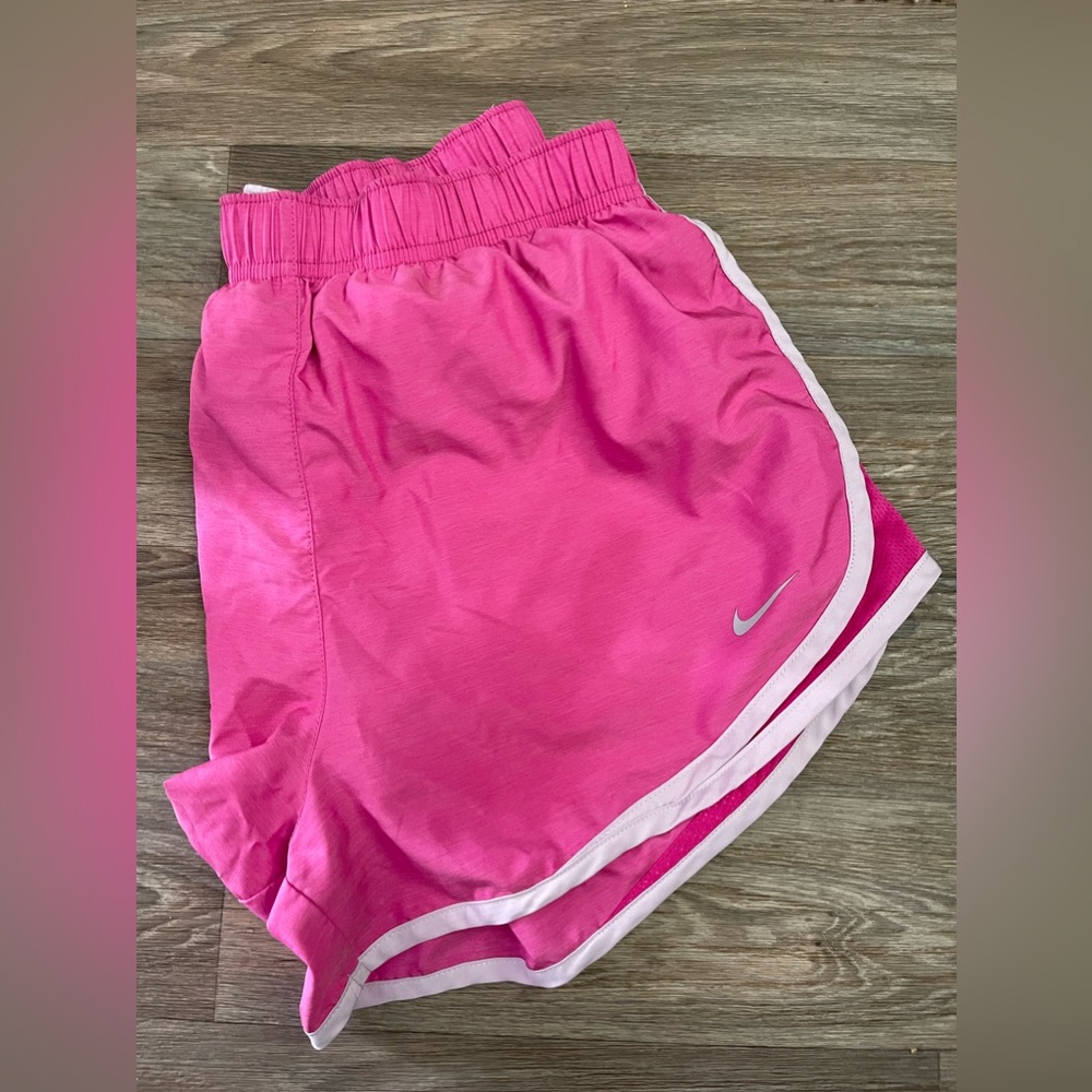 Large Pink Nike shorts.